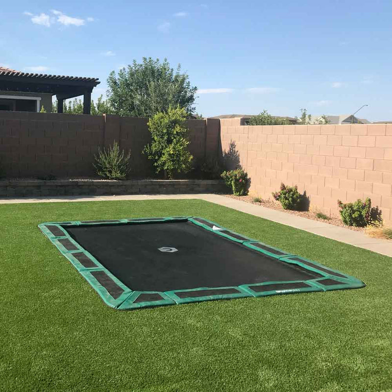 in-ground trampoline in backyard