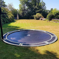 Large sunken trampoline in lawned garden Thumbnail