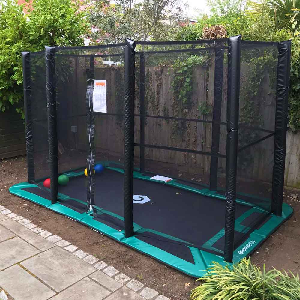 An inground trampoline with an enclosure net.