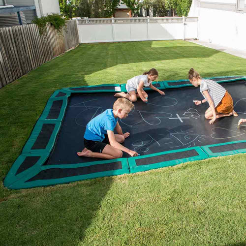 kids playing on sunken trampoline
